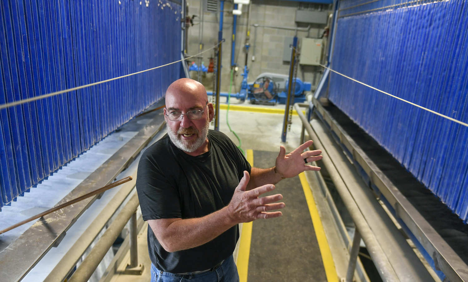 Doug Rainforth, City of Fairmont water plant supervisor, talks with a reporter between two filter presses at the Fairmont Water Treatment Plant, July 16, in Fairmont MN. August 2021