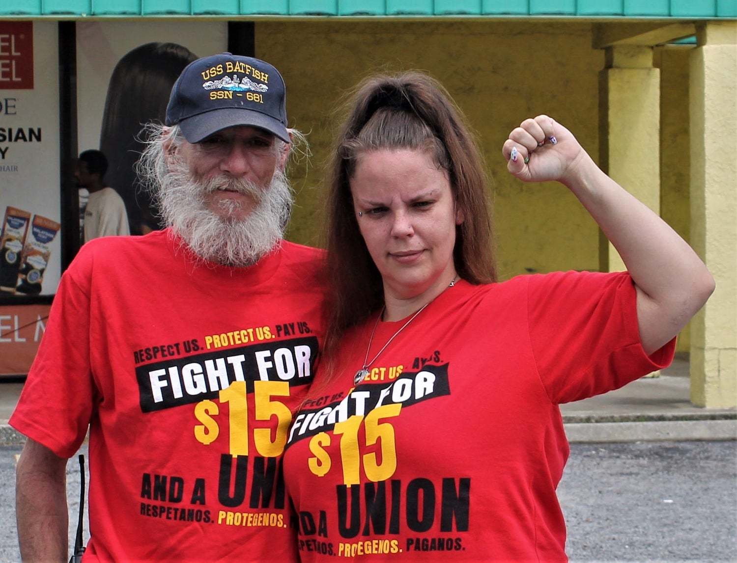 Beth Schaffer and her dad, both wearing for Fight for $15 t-shirts at a strike on July 20th.