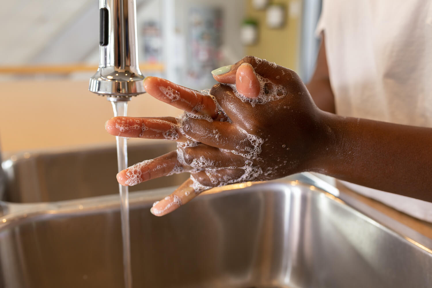 Up-close photo of someone washing their hands. September 2021