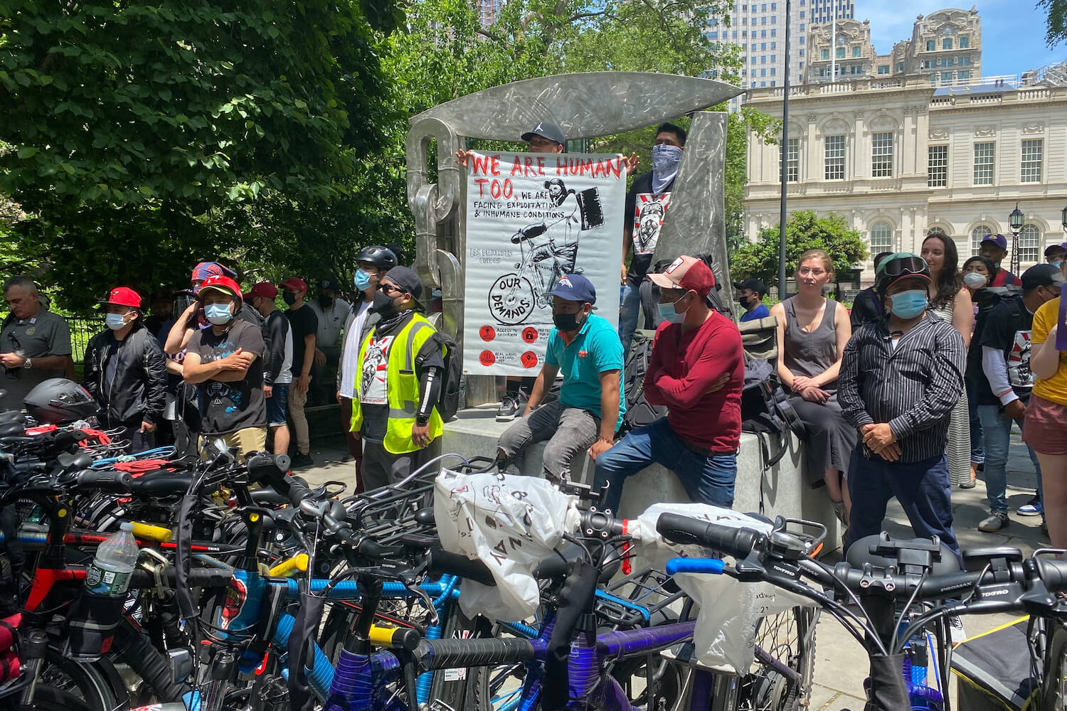 Delivery workers rallied outside City Hall while the City Council debated ways to aid them, June 8, 2021. September 2021