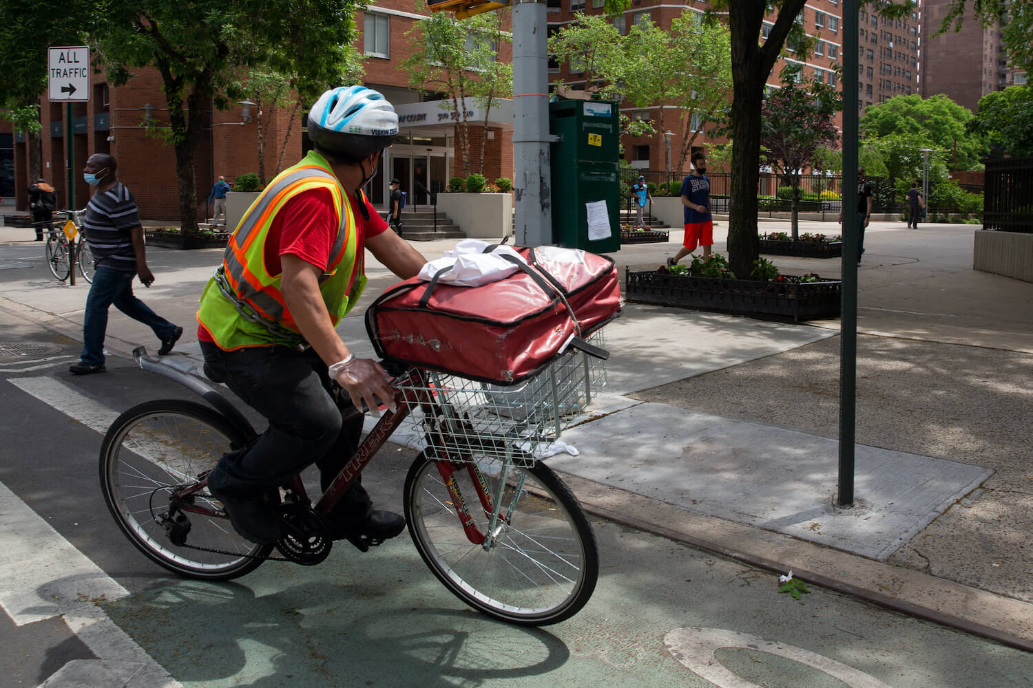 A delivery worker cycles through Kips Bay in Manhattan, June 4, 2020. September 2021