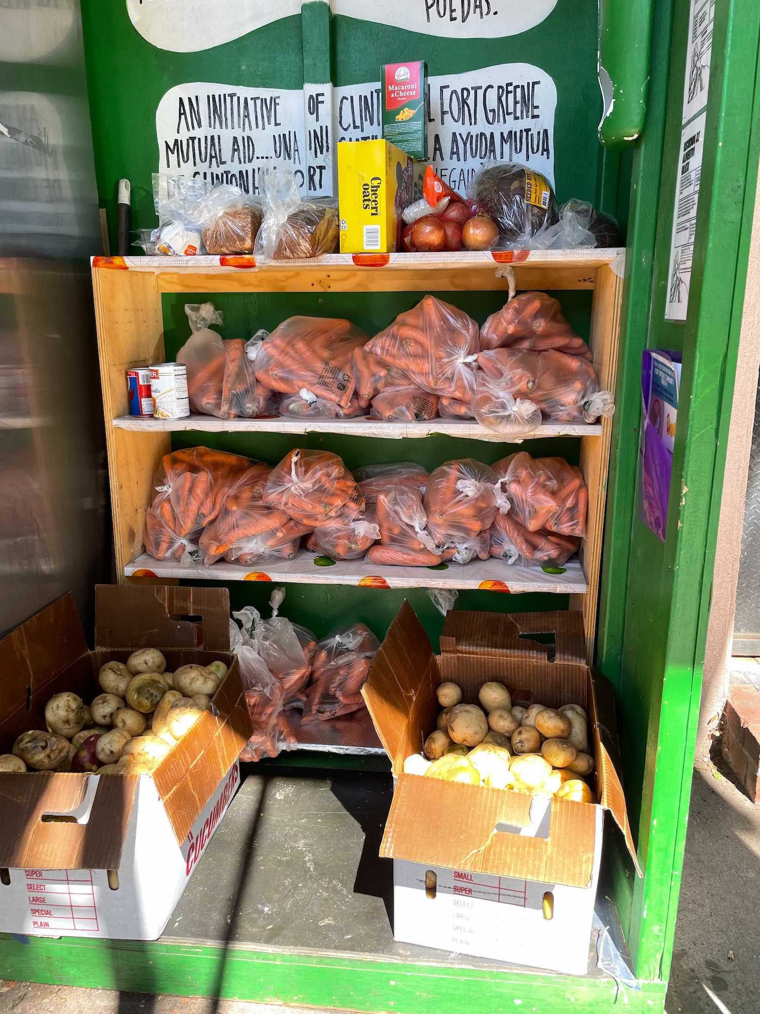 Fort Greene community fridge stocked with potatoes and carrots. October 2021