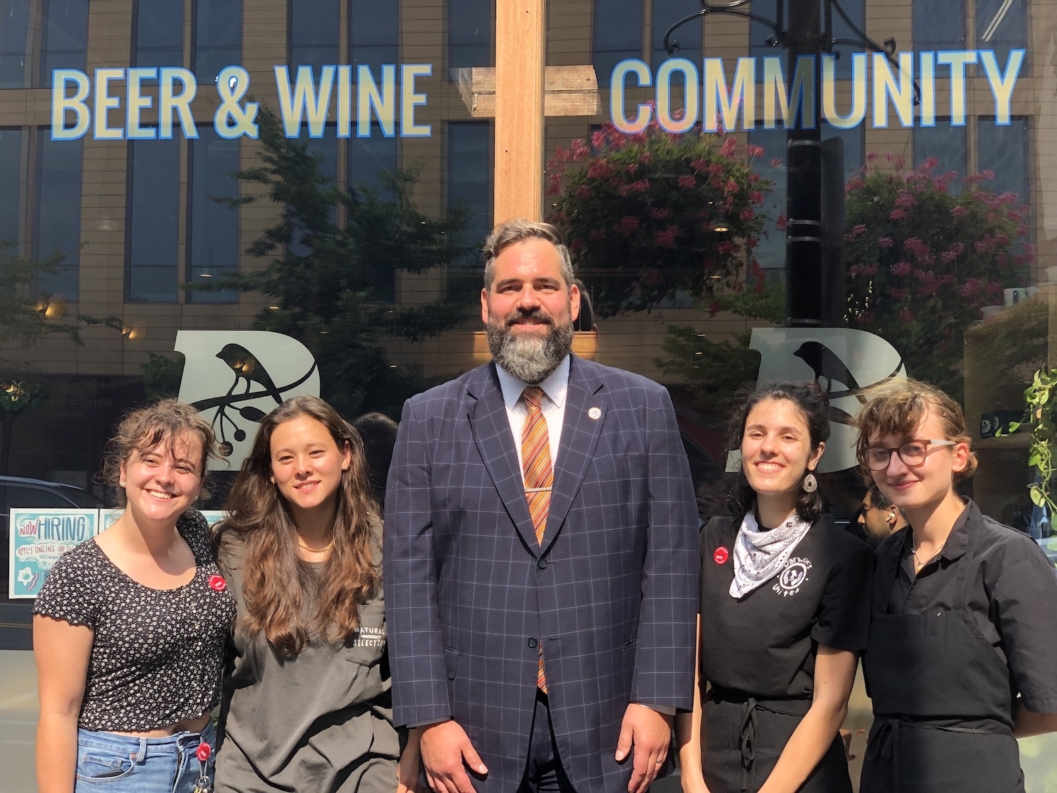 Massachusetts state representative, Mike Connolly, center, with workers, from left to right, Emma Delaney, Annina Kennedy-Yoon, Elisabeth Graham and TK at Darwin Ltd.