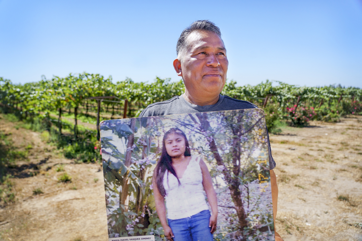 Doroteo Jimenez, of Lodi, California, holds a photograph of his niece, Maria Jimenez, who died in 2008 while working in a grapevine for 9 hours without access to water. She was only 17 at the time and pregnant.