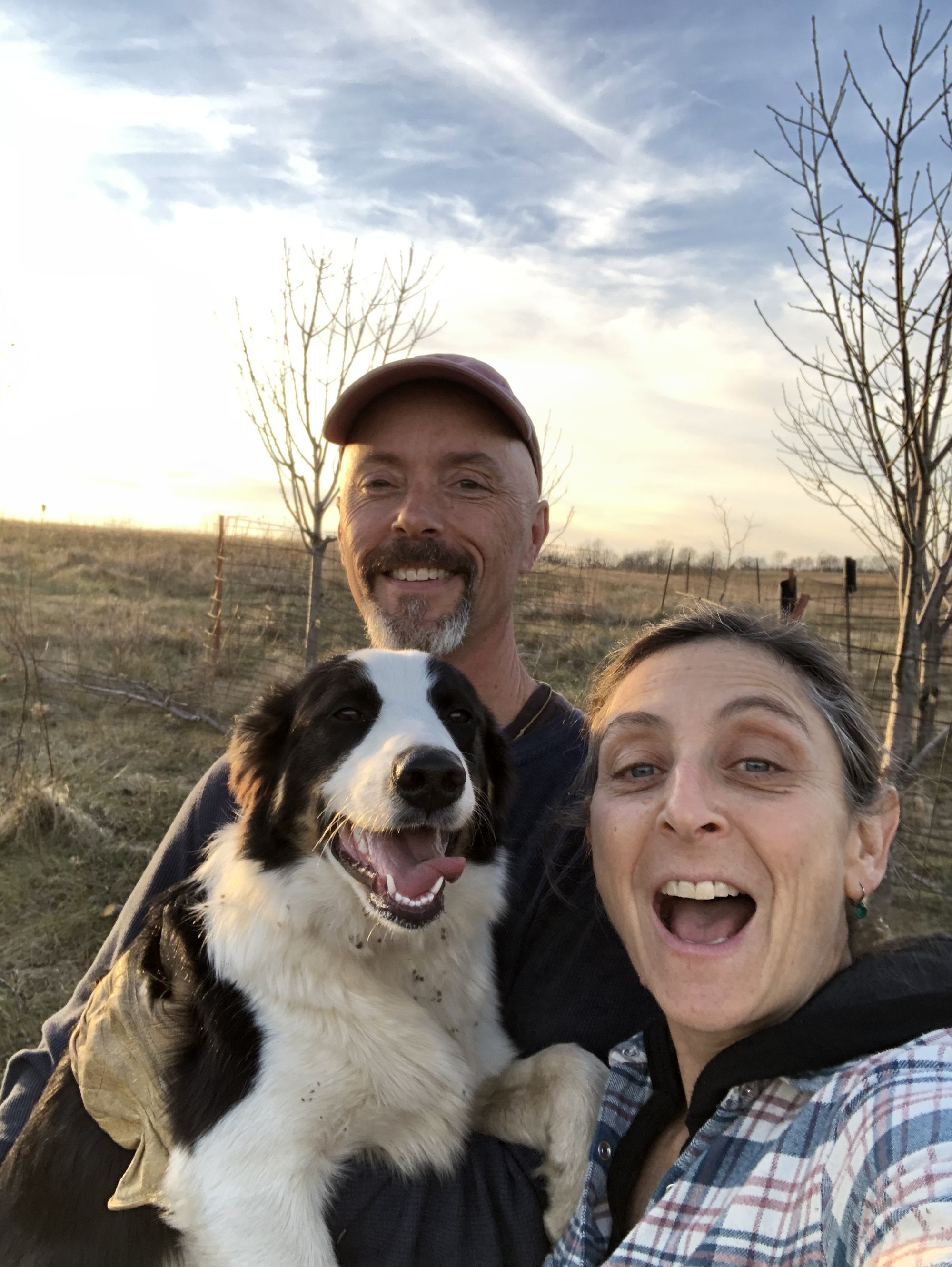 Beth Hoffman takes a selfie with her dog and partner in field. November 2021