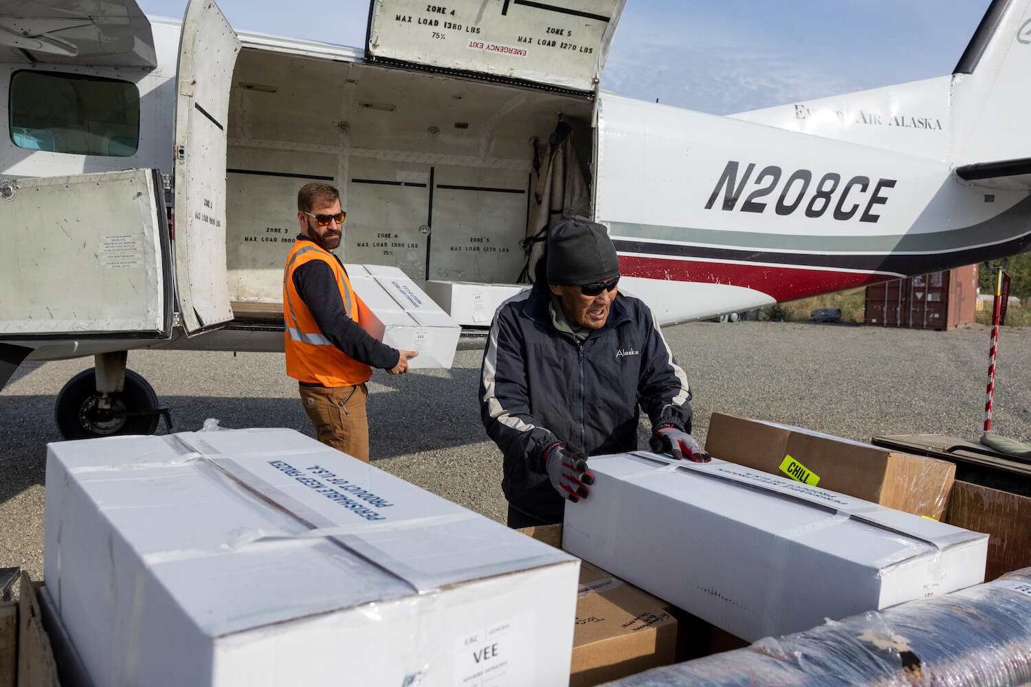 A charter flight unloads Bristol Bay salmon in Venetie, one of the 42 Interior villages that received fish donations. November 2021