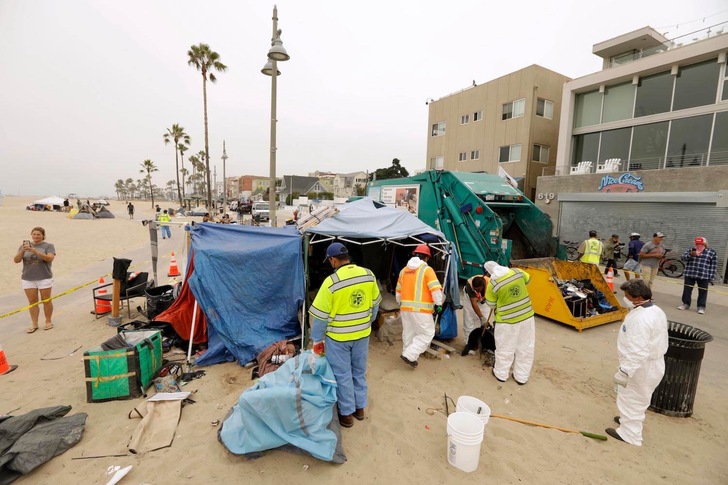 City of Los Angeles sanitation workers clear a homeless encampment along Ocean Front Walk in Venice on July 30, 2021.