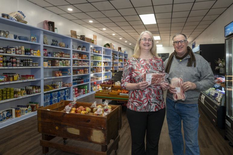 General manager Bonnie Davis and board member and farmer Tom Martin pose for a portrait inside the Market on the Hill in Mt. Pulaski, Illinois January 2022.