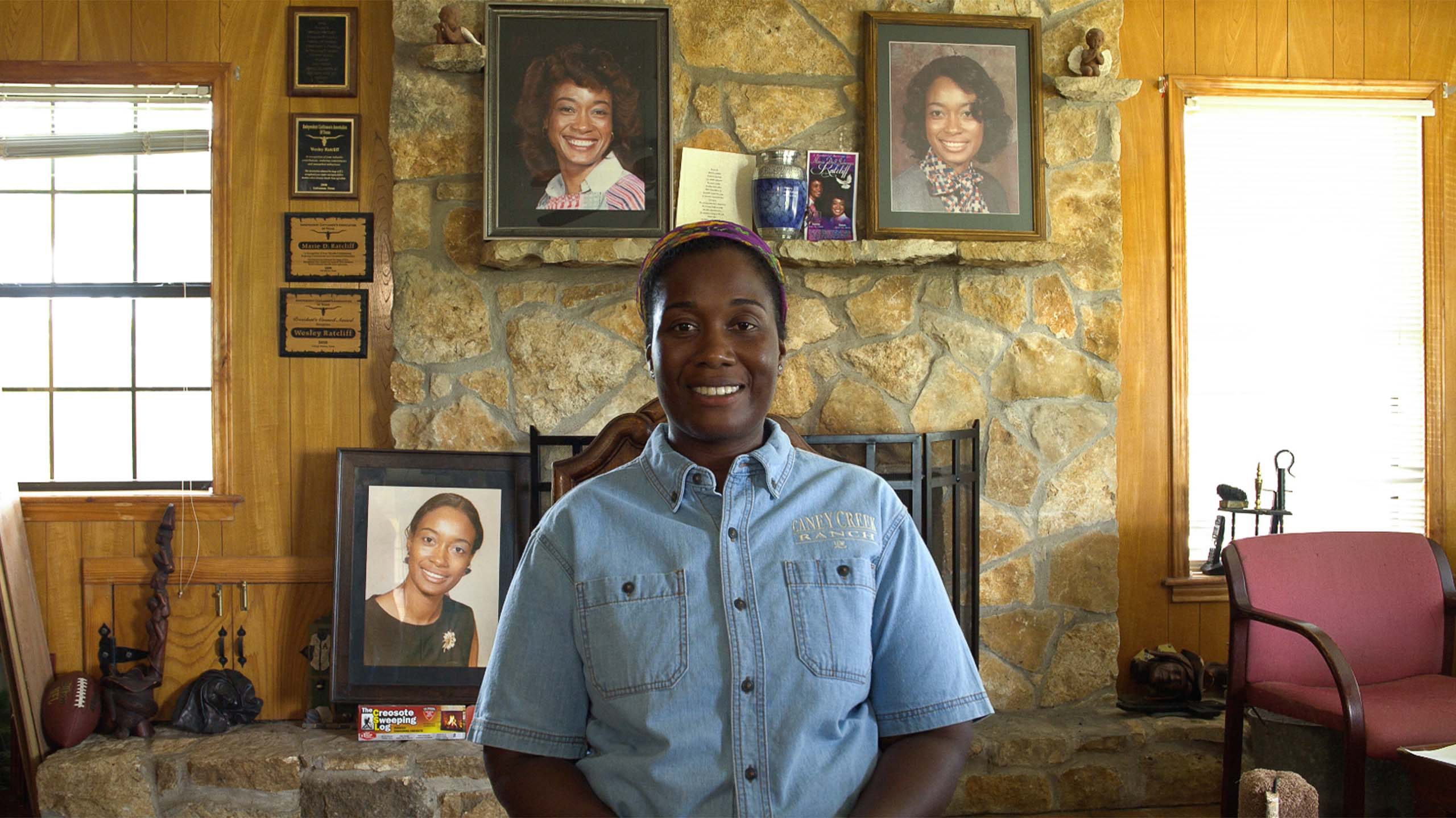 Kimberly Ratcliff pictured in front of photos of her late mother. July 2019