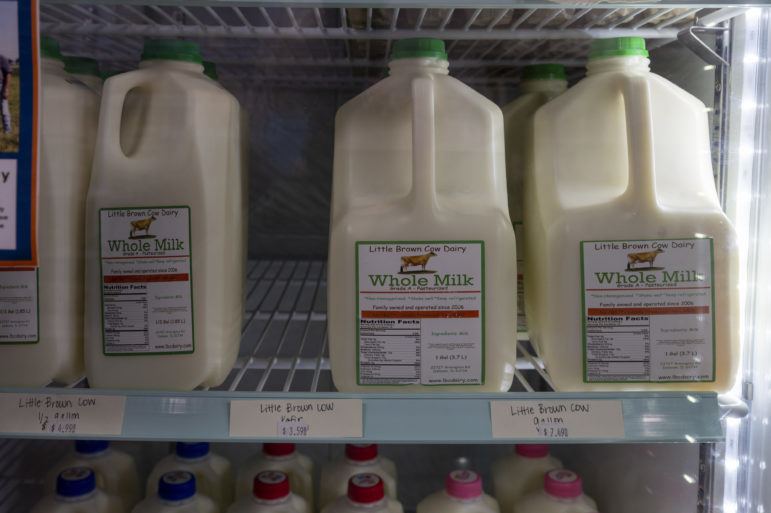 Locally produced milk for sale at Market on the Hill in Mt. Pulaski, Illinois January 2022.