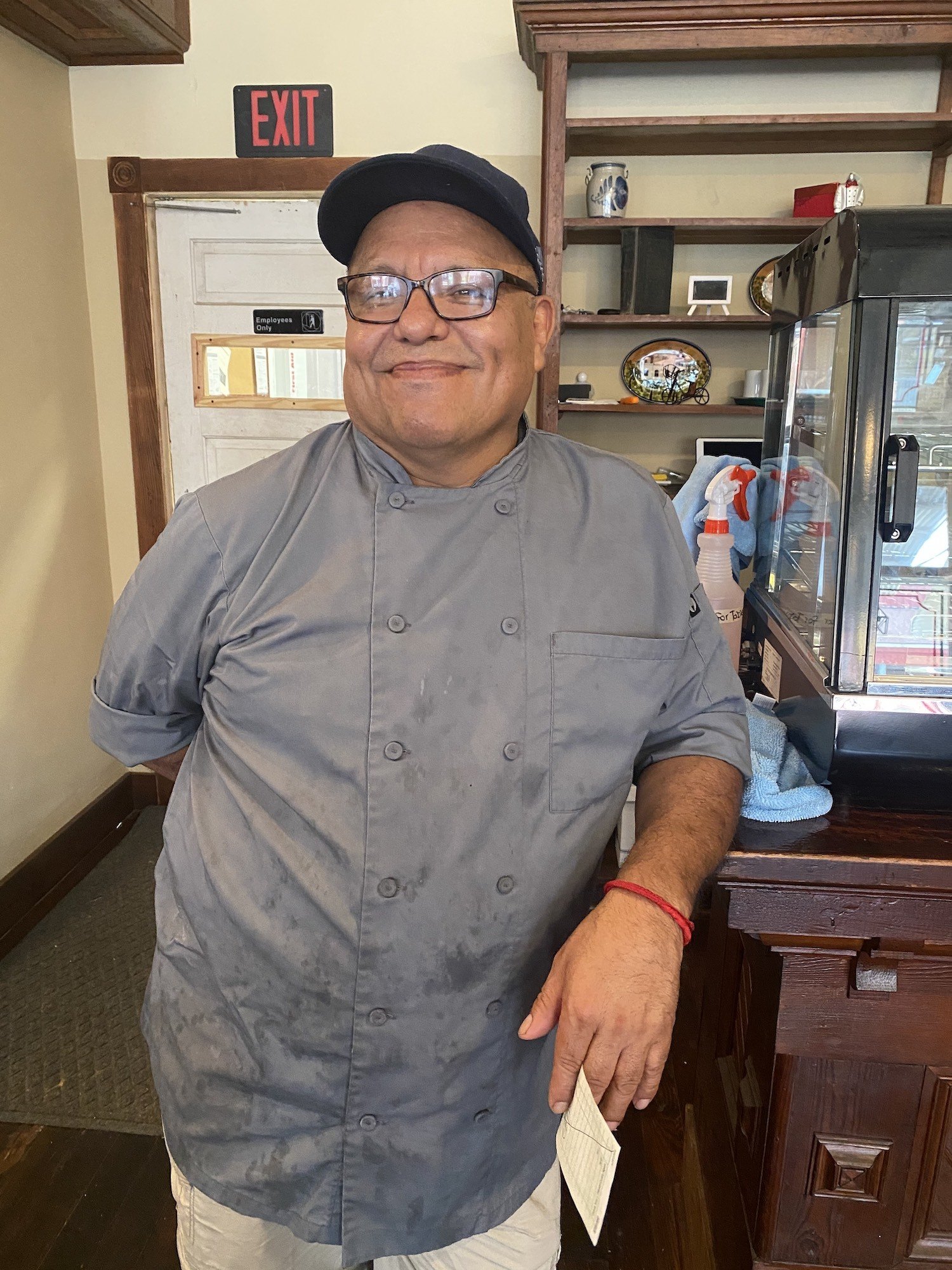 Nick Flores 60, opened Nick's Place in downtown Crawfordville, Georgia. Flores stands smiling in front of the camera. January 2022