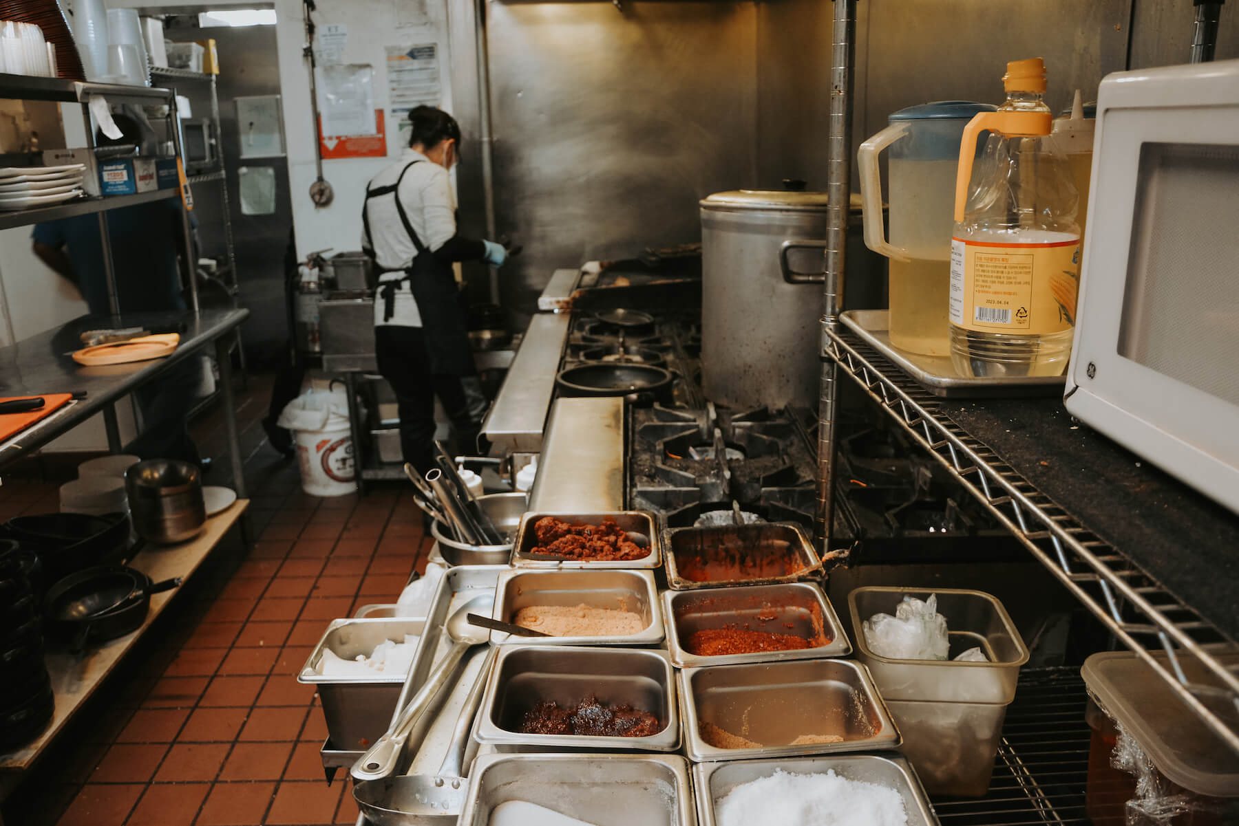 Wide shot of kitchen spices, stoves, and prep space at Daol Tofu in Oakland, CA. August 2021