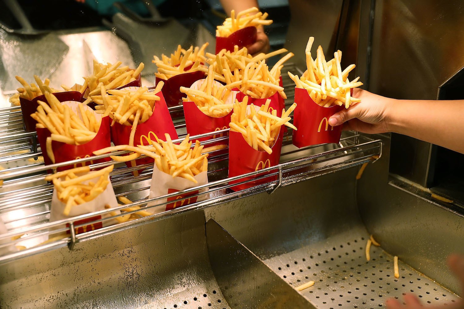 McDonald's crew member Samantha Medina prepares french fries as the McDonald's restaurant. April 25, 2017