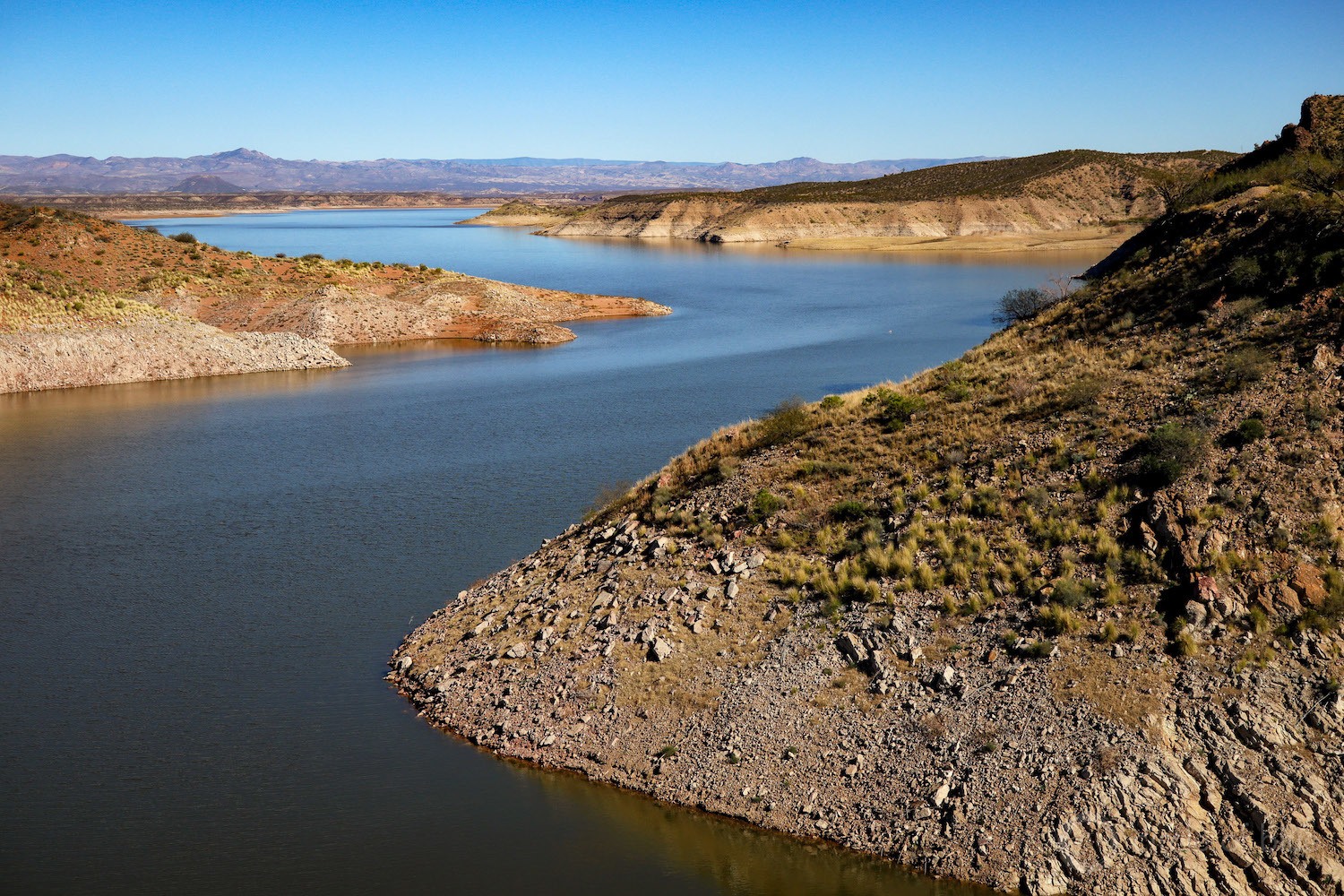 Climate change is intensifying heat and drought in the mountains east of Phoenix and has left San Carlos Lake, formed by 92-year-old Coolidge Dam, 97 percent empty.