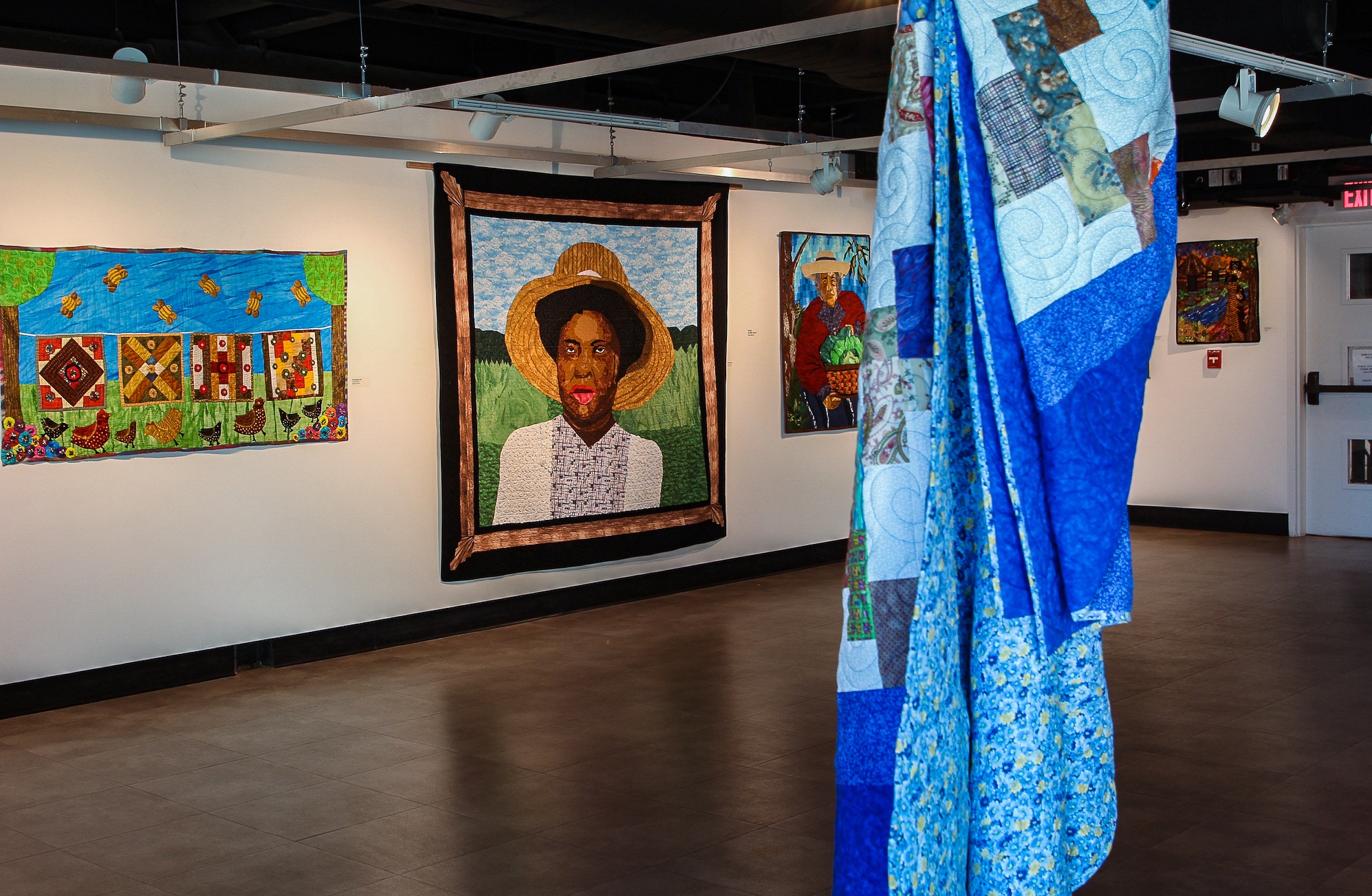 Quilts hang in Charleston's City Gallery. Feb. 2022
