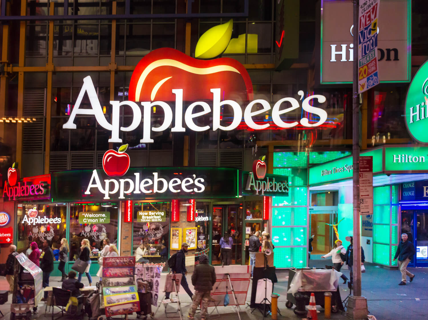 Applebee's restaurant at Times Square in New York City, USA Applebees International, Inc., is an company which develops, franchises, and operates the Applebee's Neighborhood Grill and Bar restaurant chain. May 2022