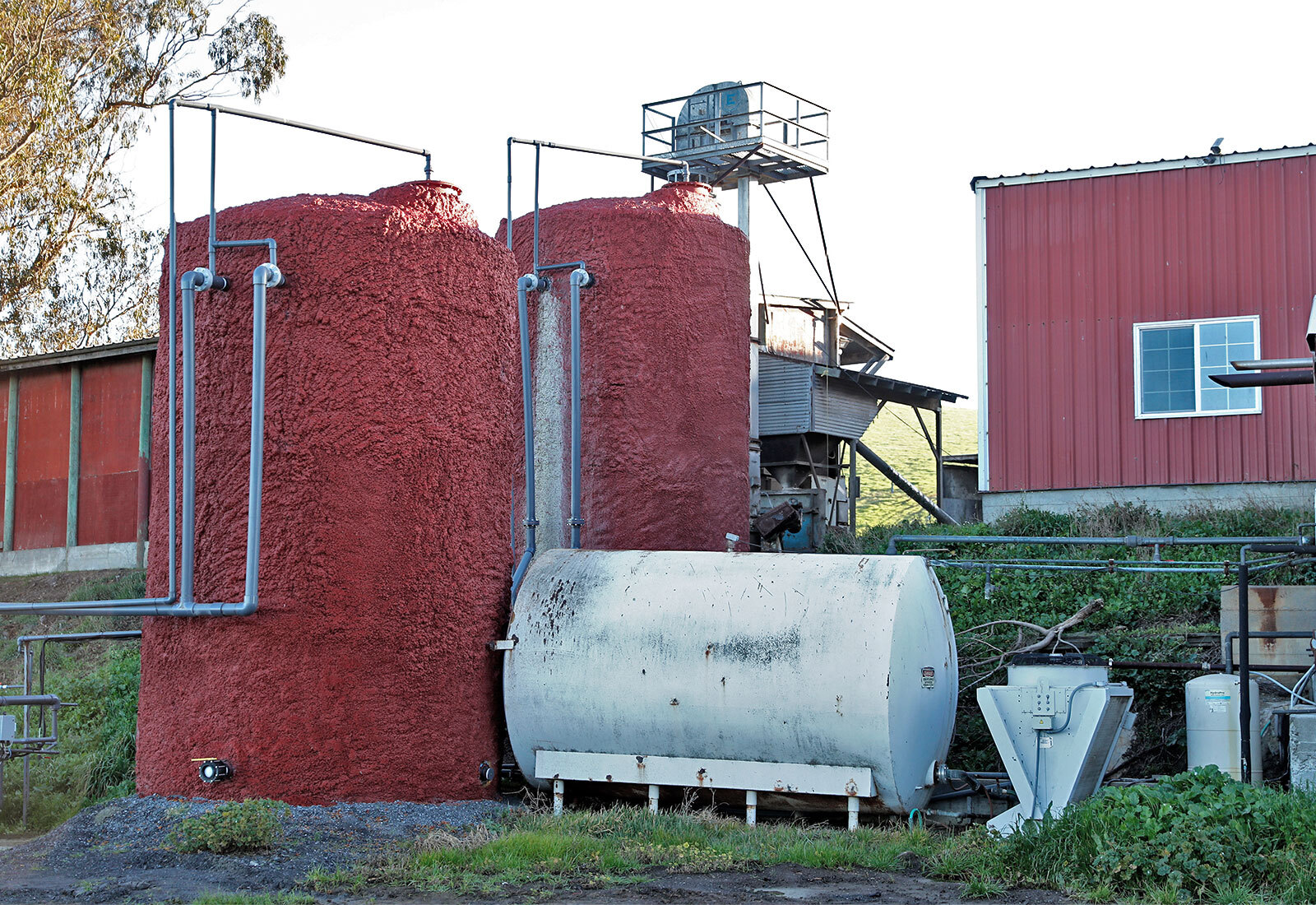 A methane digester stands on Straus Dairy Farm in Marshall, California. May 2022